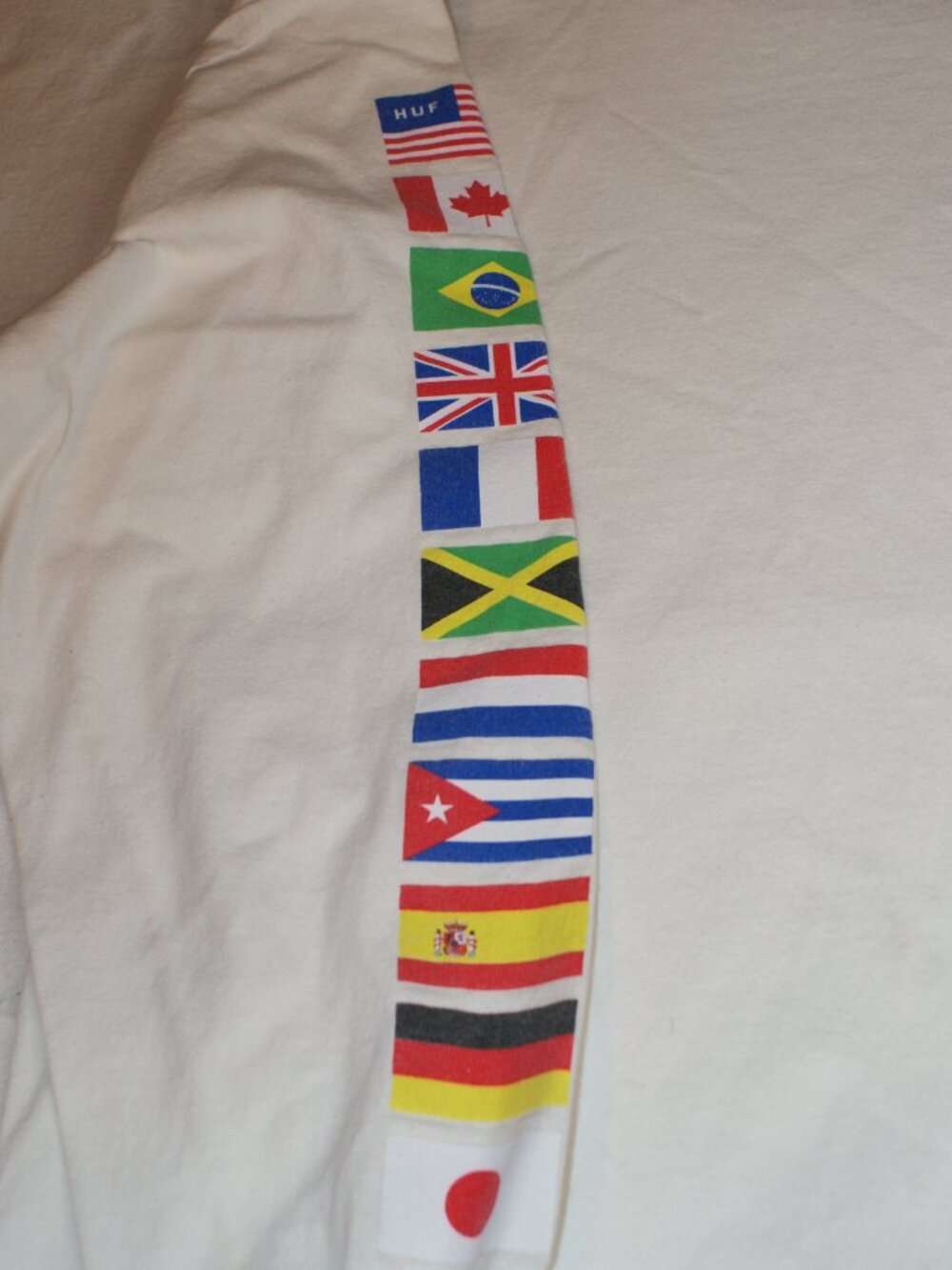 Huf T-Shirt with International flags on sleeve